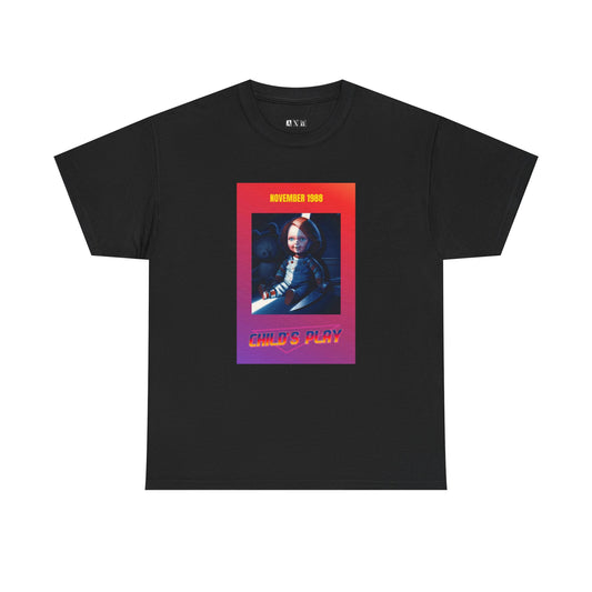 Child’s Play unisex heavyweight tee shirt featuring Chucky grinning with a knife framed in fiery neon. Marked “November 1988,” it’s a sinister tribute to the birth of a legend. A must-have for fans who dare wear the nightmare.