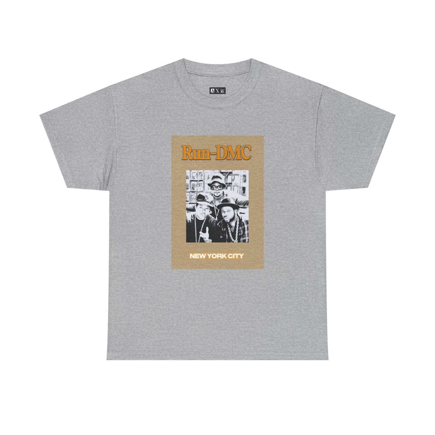 Run-DMC unisex heavyweight tee shirt featuring the iconic group posing in classic streetwear, topped with bold orange "Run-DMC" lettering and “NEW YORK CITY” stamped below. A tribute to one of hip-hop’s greatest pioneers.
